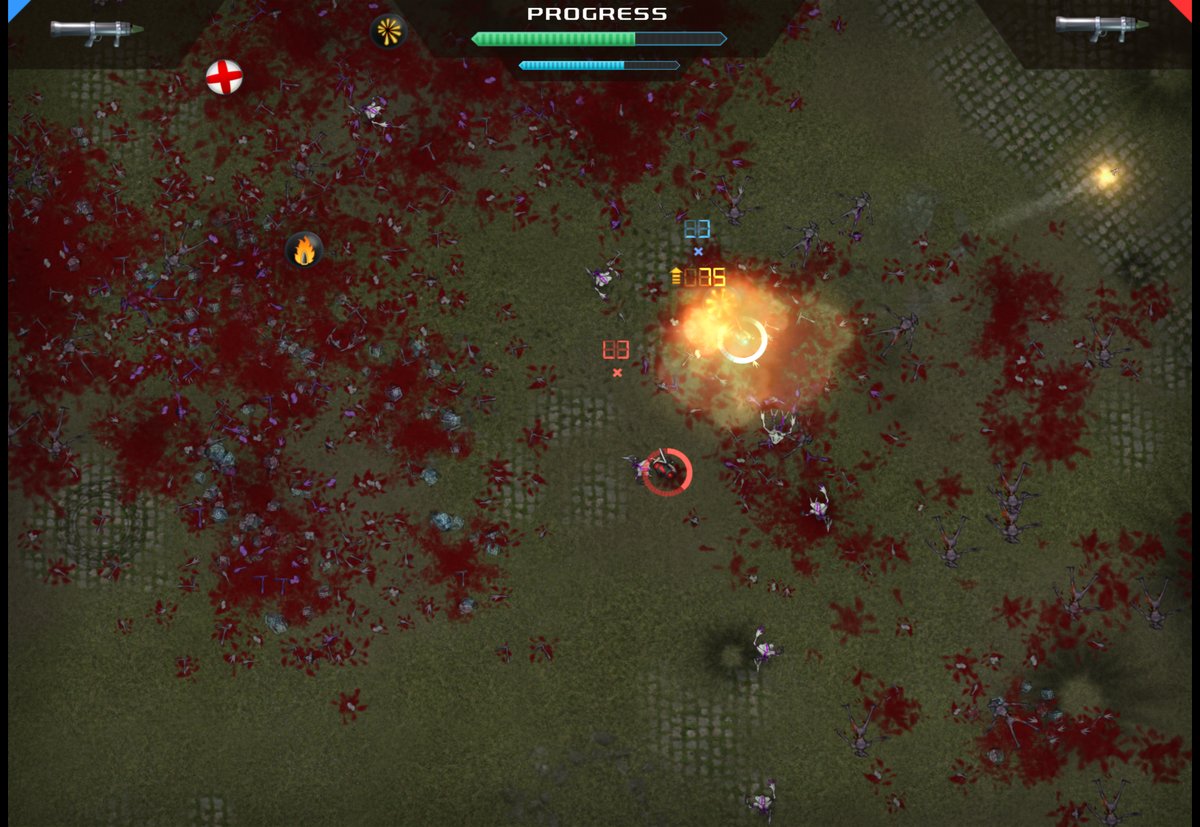 A rocket explosion next to the red player, the ground covered in blood and dead aliens, power-ups lying around