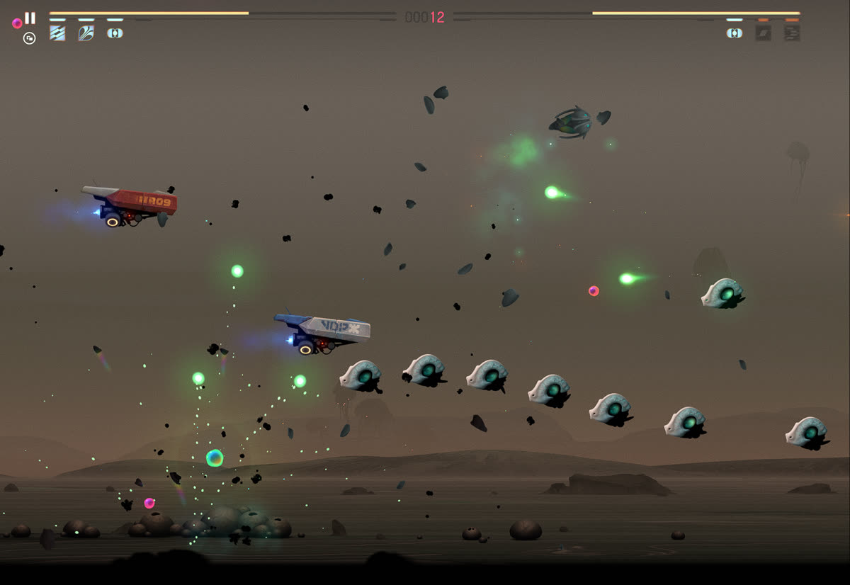 A row of pale shelled creatures flies past the two tanks while green shots come in