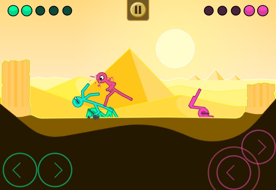 A desert stage with pyramids, both players tangled up mid fight